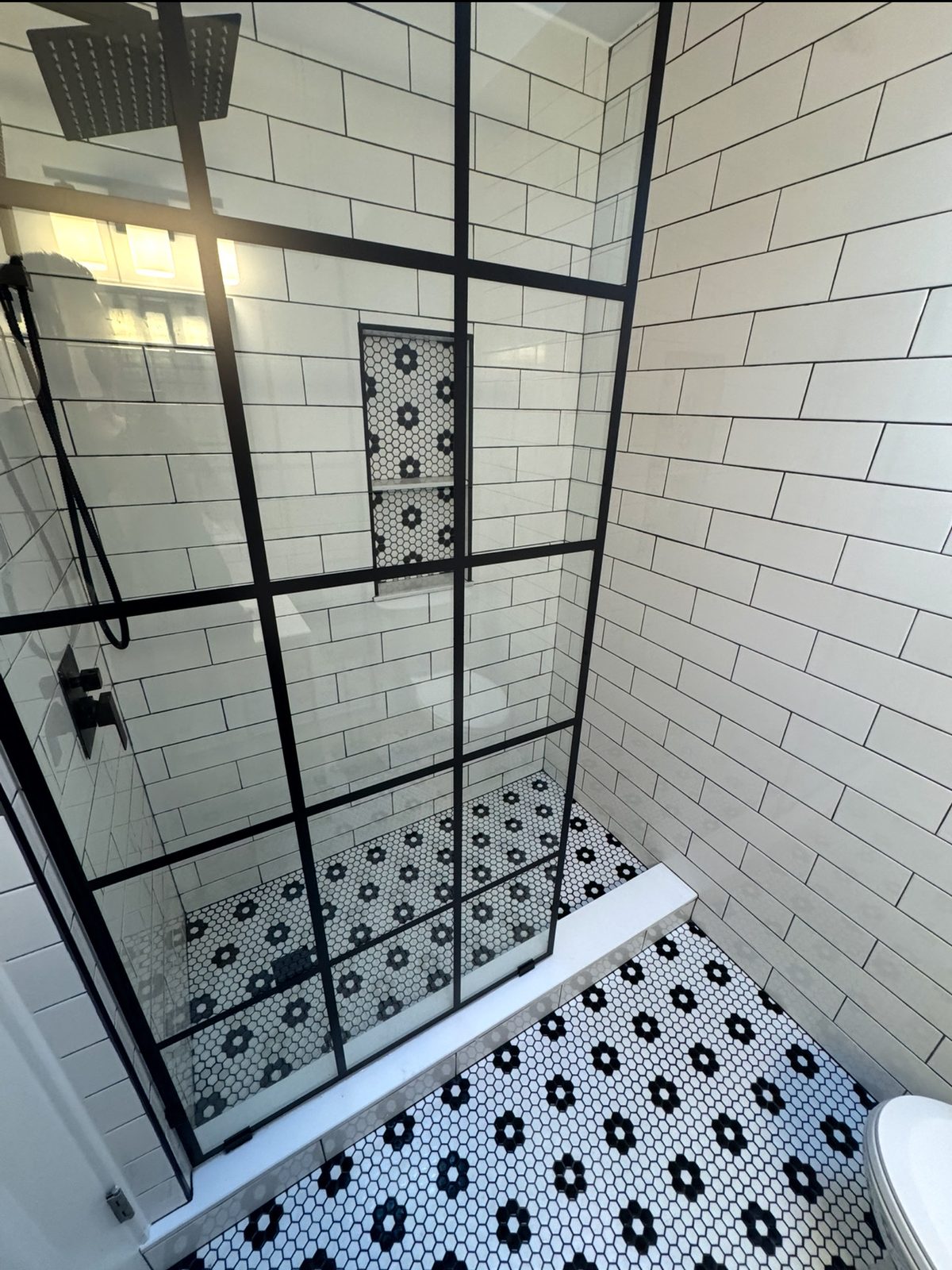 Custom shower remodel with hexagonal mosaic tile by Altieri and Sons