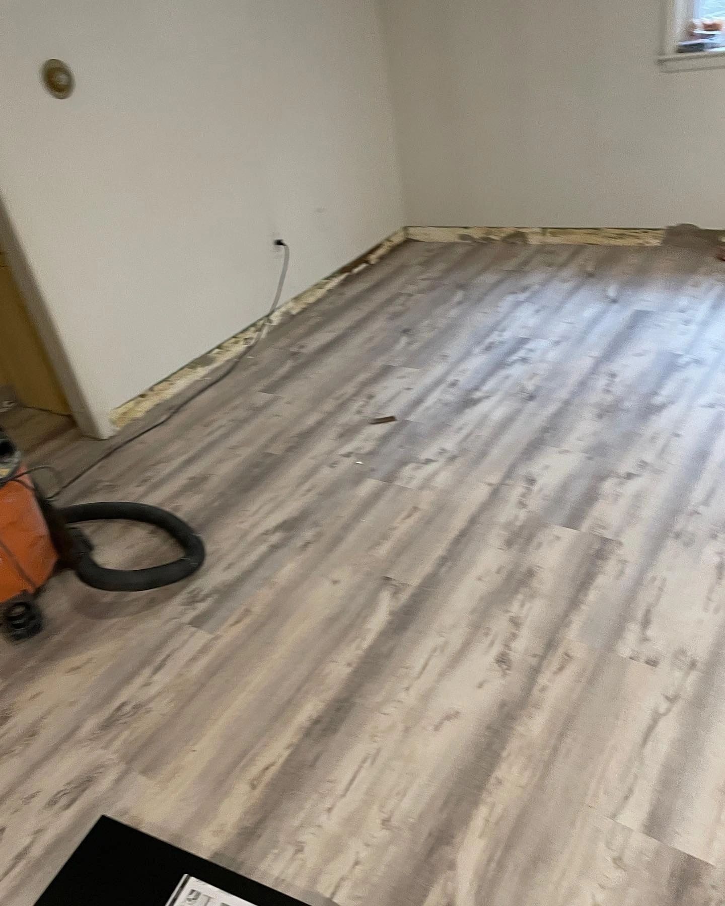 Luxury vinyl plank flooring installation in residential room