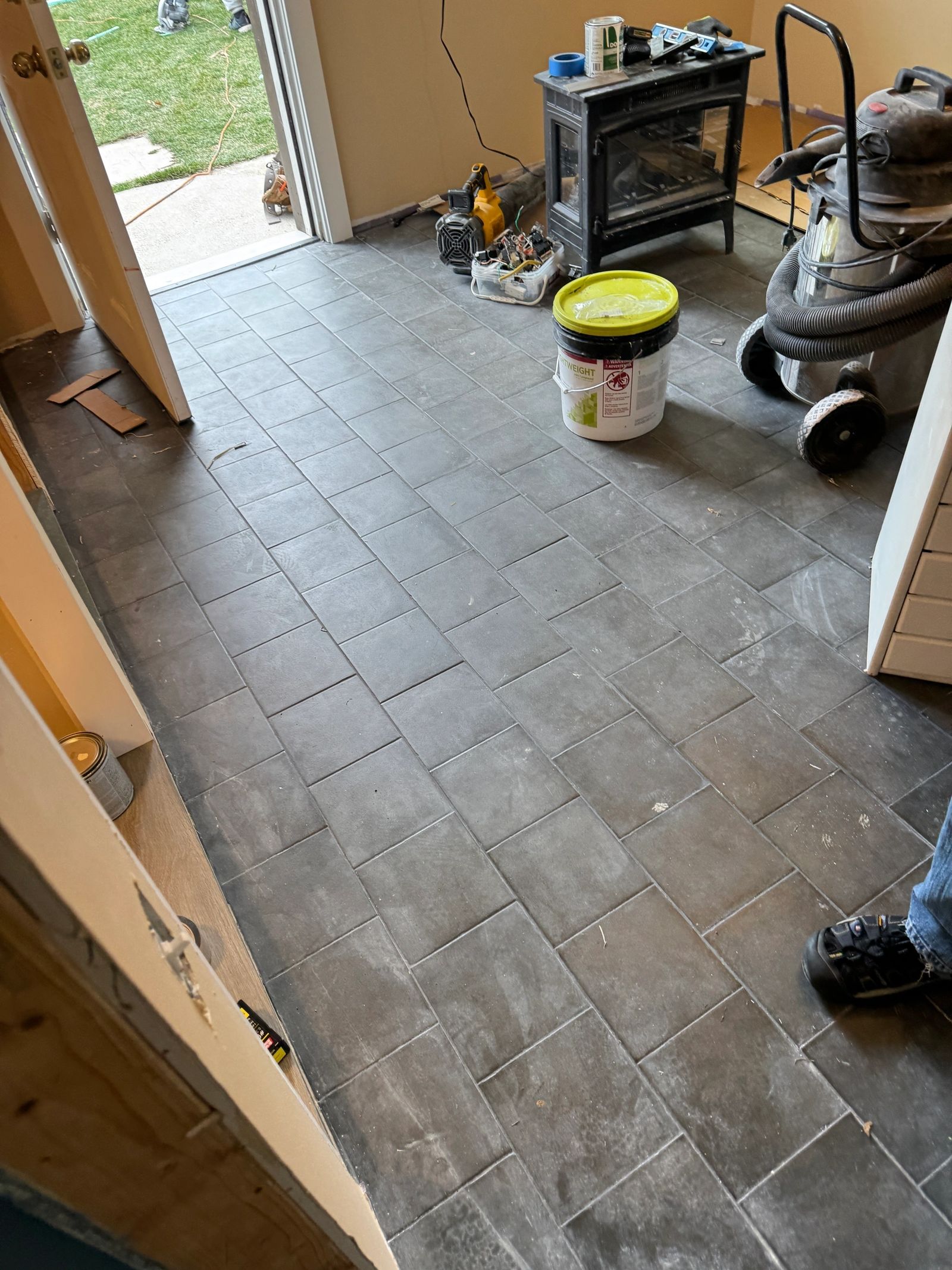 Hardwood flooring installation in progress in home