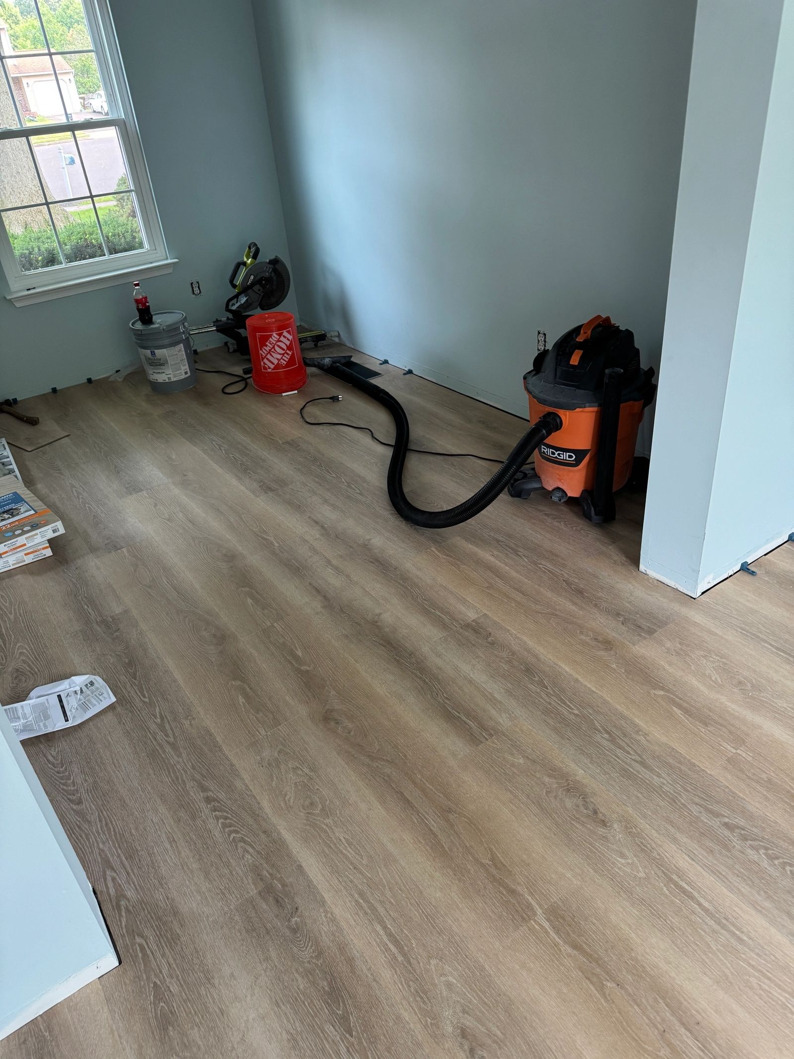 Flooring installation with precision cuts and detail work