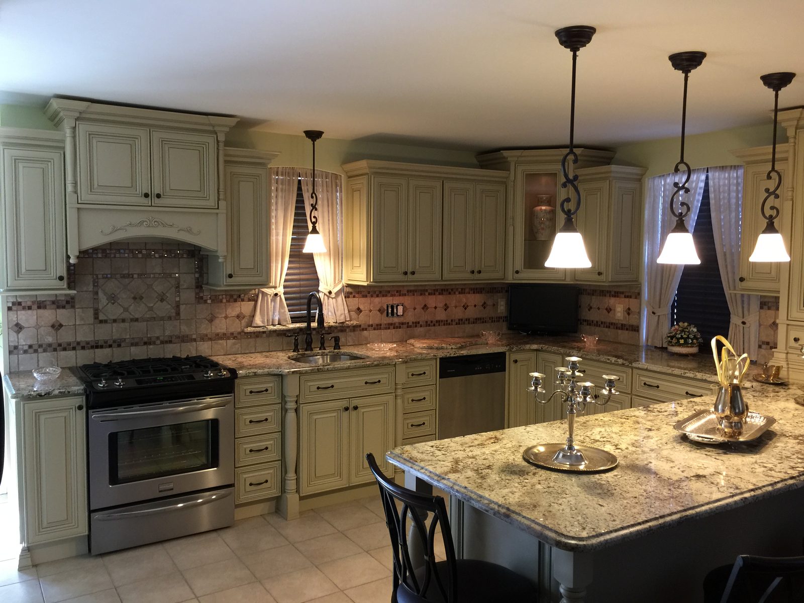 Classic kitchen remodel with cream cabinets and granite countertops by Altieri and Sons