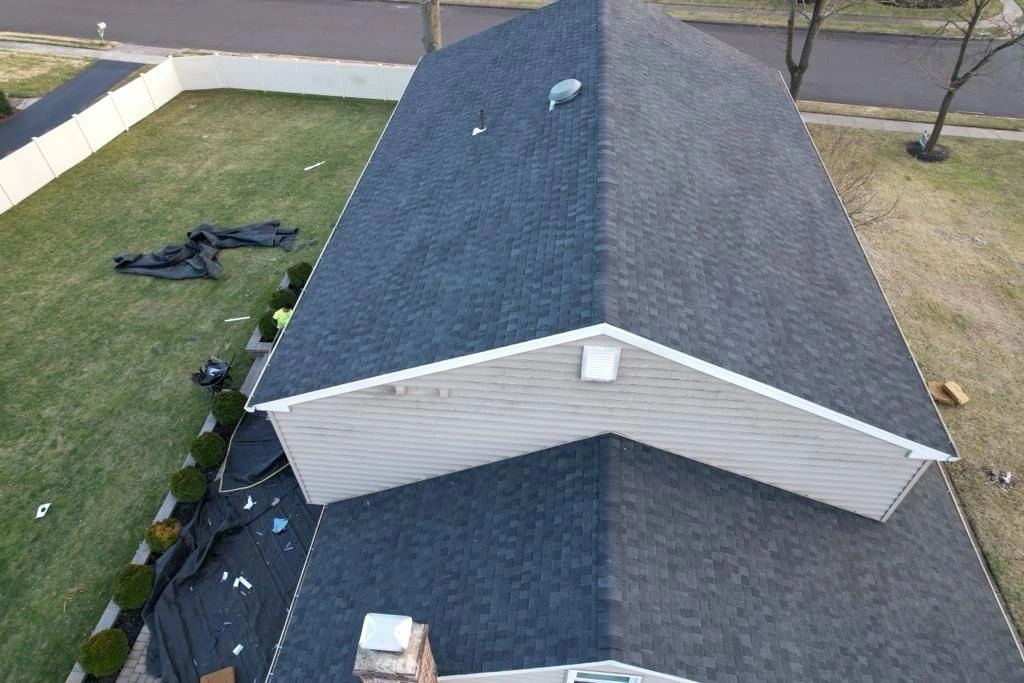 Aerial view of completed dark architectural shingle roof replacement by Altieri and Sons