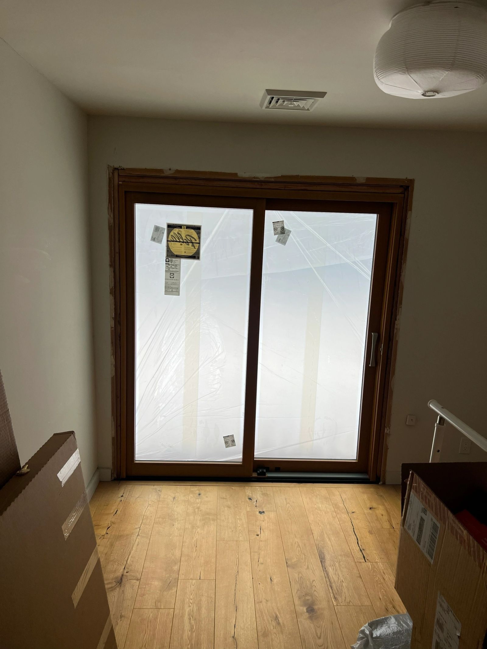 Newly installed sliding patio door with protective film
