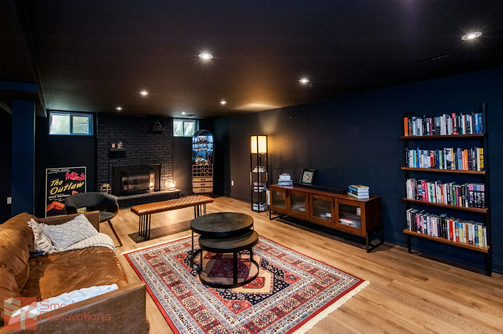 Cozy finished basement with fireplace and bookshelves