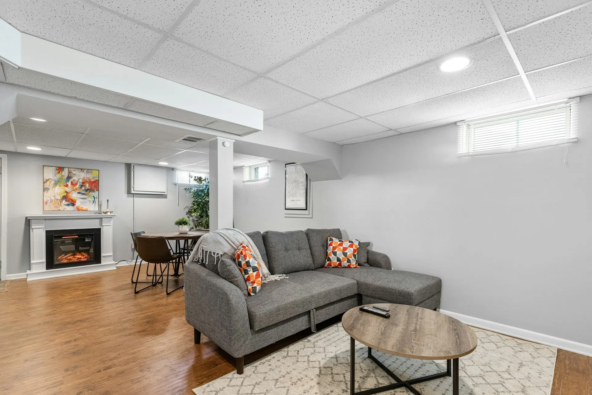 Basement living room with fireplace and entertainment area