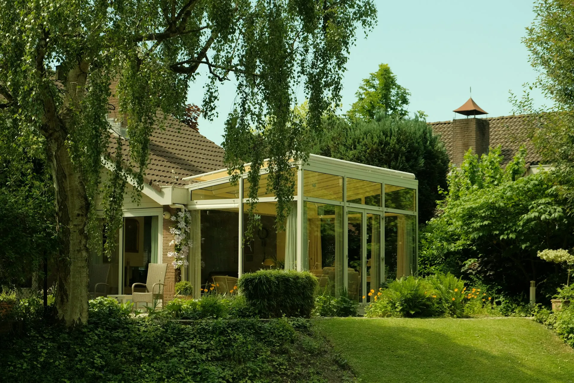 Modern sunroom addition with large windows and natural light