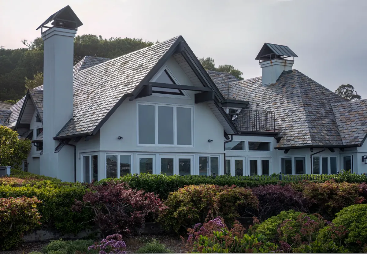 Residential roof showing shingles on a suburban home
